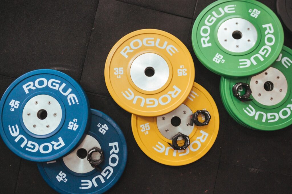 bumper plates vs iron, bumper plates vs steel plates, bumper plates vs iron plates, bumper plates vs metal plates, bumper plates vs weight plates, bumper plates vs regular plates